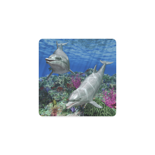 Two cute dolphins swim in the ocean Square Coaster