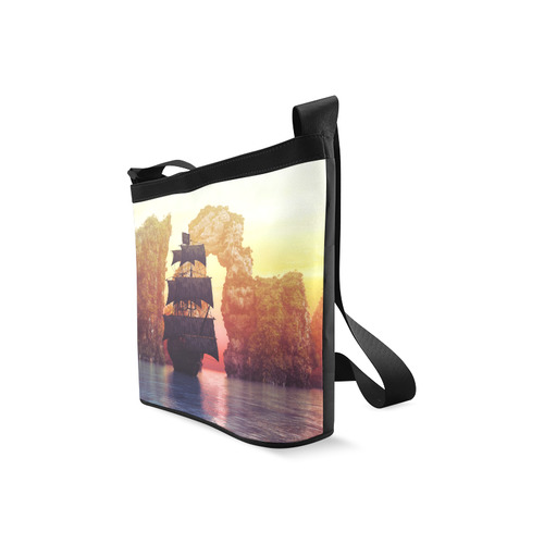 A pirate ship off an island at a sunset Crossbody Bags (Model 1613)