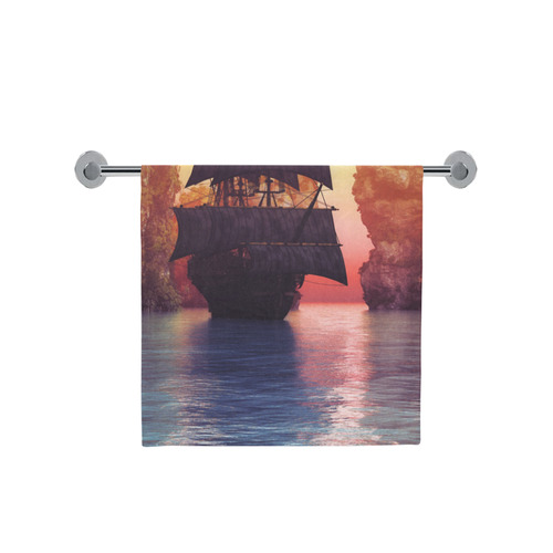 A pirate ship off an island at a sunset Bath Towel 30"x56"