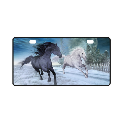 Two horses galloping through a winter landscape License Plate