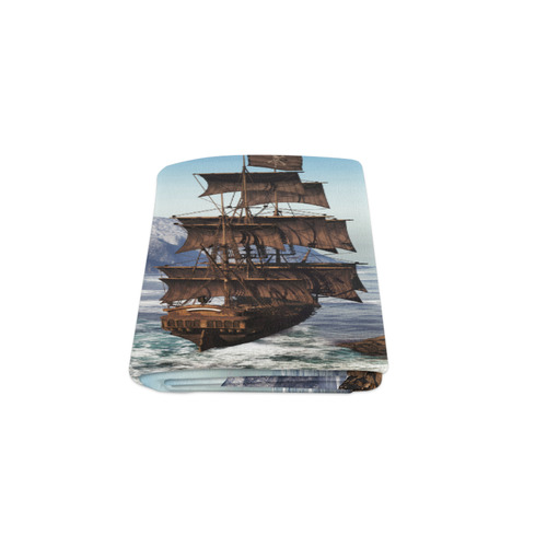 A pirate ship sails through the coastal Blanket 50"x60"