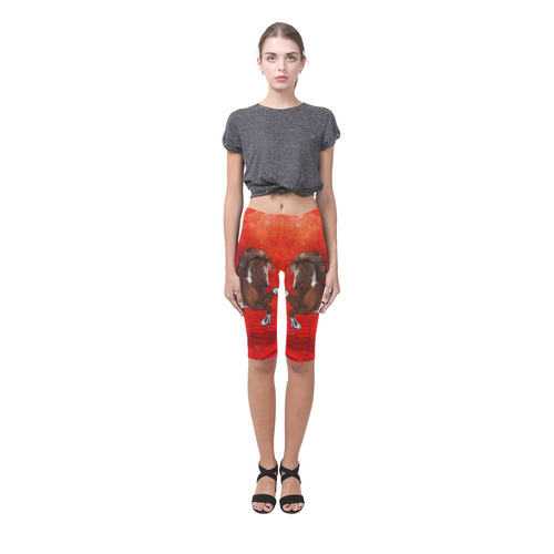 Wild horse on red background Hestia Cropped Leggings (Model L03)