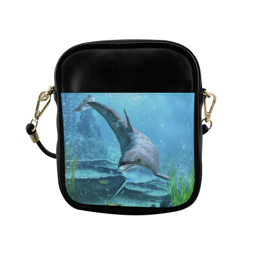 A proud dolphin swims in the ocean Sling Bag (Model 1627)