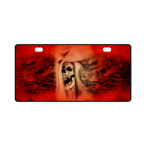Creepy skulls on red background License Plate